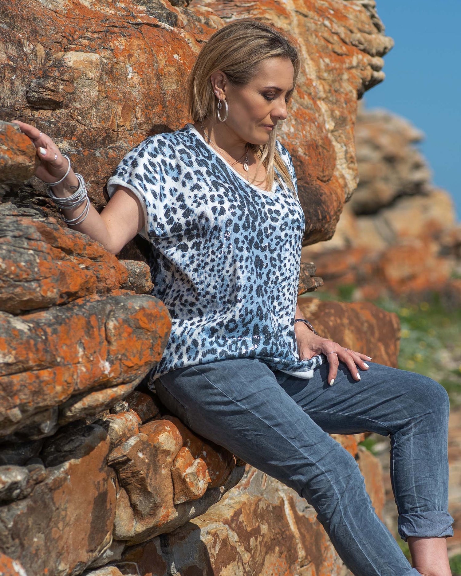 Prepare to turn heads and steal the spotlight! This top boasts a daring animal print pattern that is brought to life with a lavish array of sequins, creating a dazzling effect that catches the light with every move. The medium stretch fabric ensures a comfortable fit that hugs your curves in all the right places, allowing you to move with confidence and ease