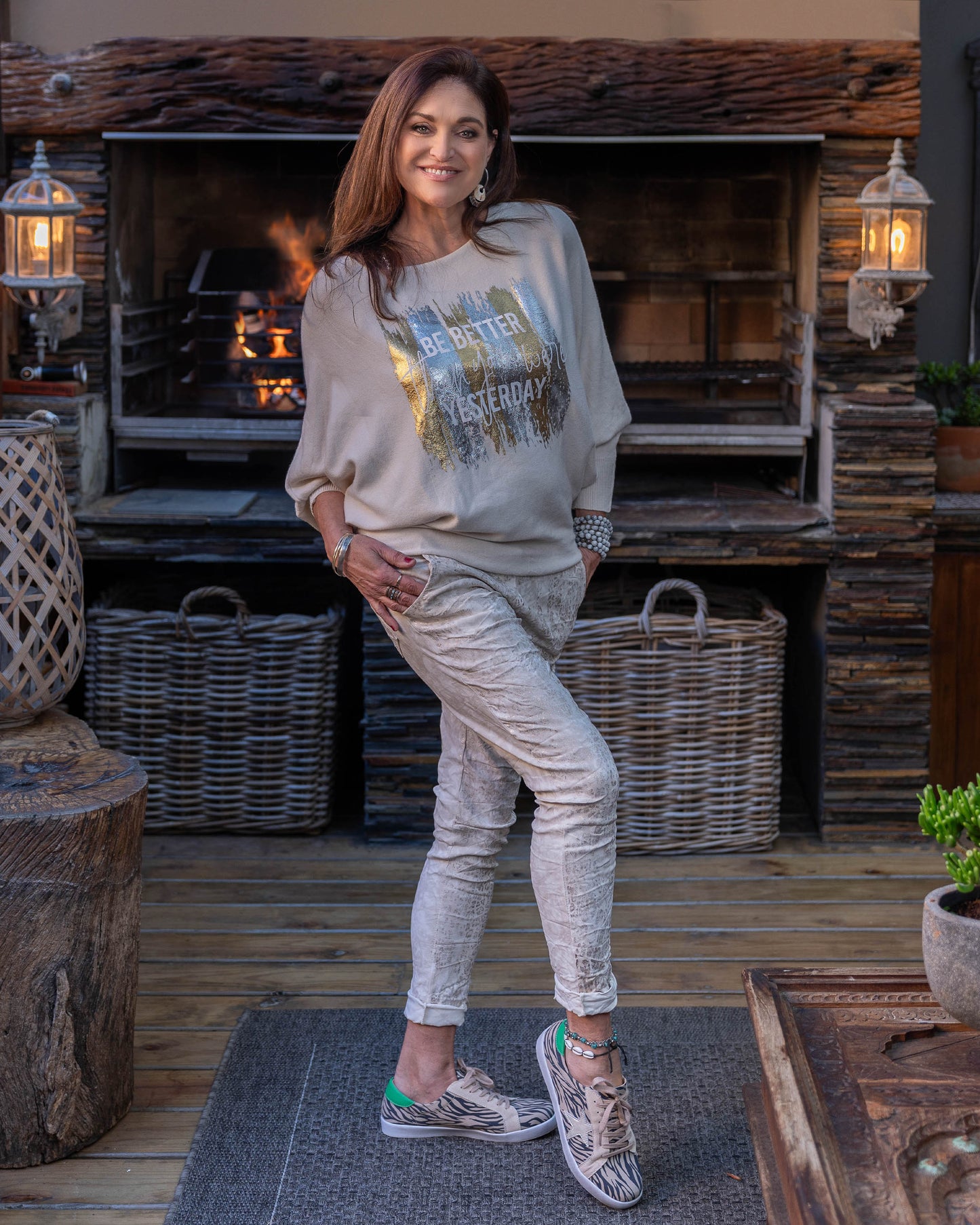 A new take on our ever so popular knits! The batwing cut design offers a relaxed fit through the arms and shoulders. The knit transitions into fitted hips, creating a flattering shape that complements the batwing sleeves. The scoop neck design beautifully frames your face, adding a touch of elegance to the knit. Foil print catches the light beautifully, making this knit perfect for both day and evening wear