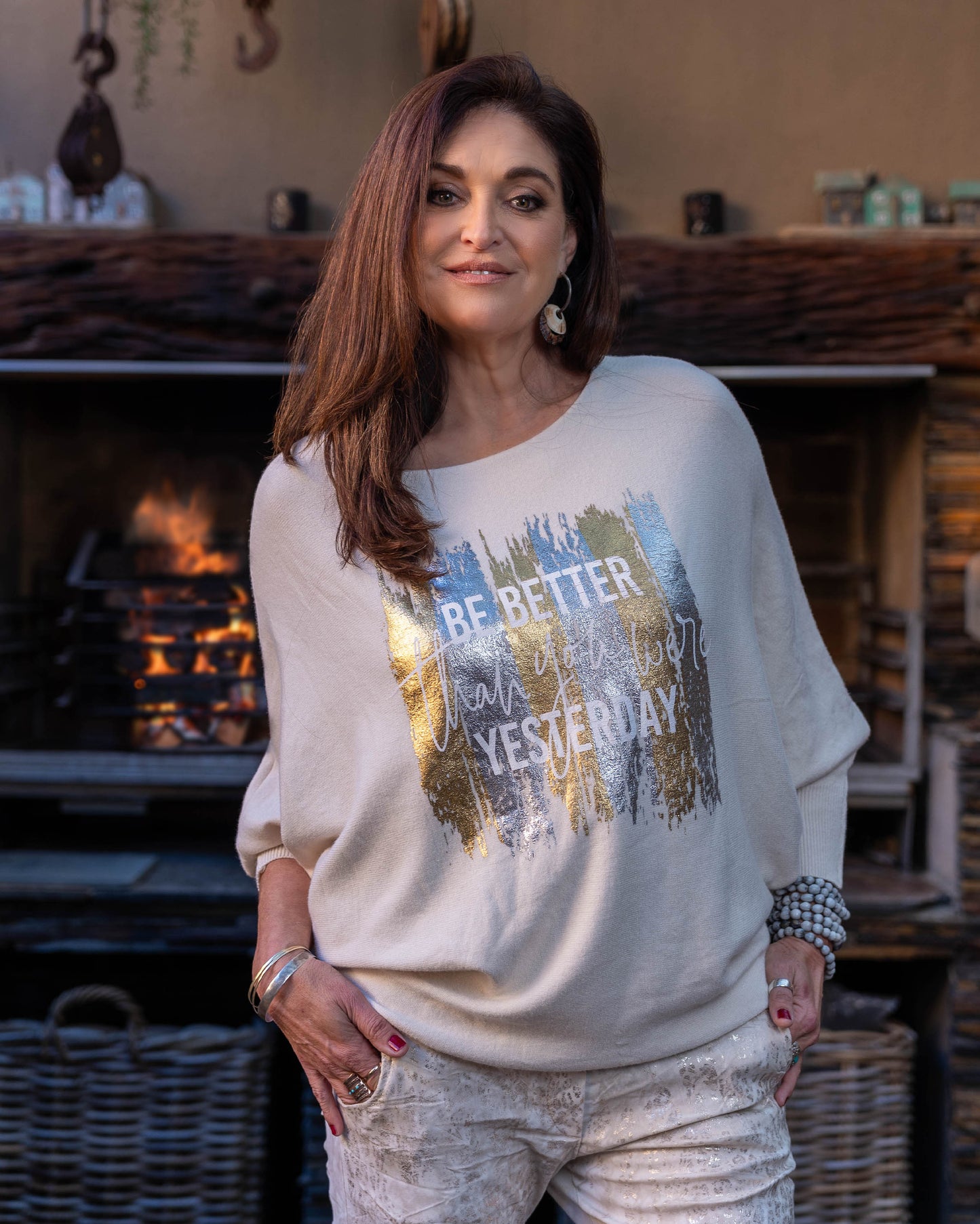 A new take on our ever so popular knits! The batwing cut design offers a relaxed fit through the arms and shoulders. The knit transitions into fitted hips, creating a flattering shape that complements the batwing sleeves. The scoop neck design beautifully frames your face, adding a touch of elegance to the knit. Foil print catches the light beautifully, making this knit perfect for both day and evening wear