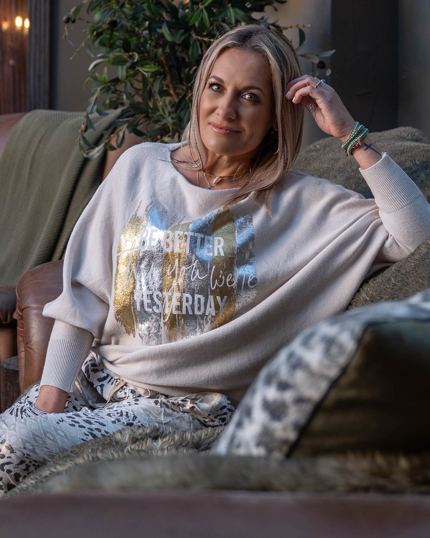 A new take on our ever so popular knits! The batwing cut design offers a relaxed fit through the arms and shoulders. The knit transitions into fitted hips, creating a flattering shape that complements the batwing sleeves. The scoop neck design beautifully frames your face, adding a touch of elegance to the knit. Foil print catches the light beautifully, making this knit perfect for both day and evening wear