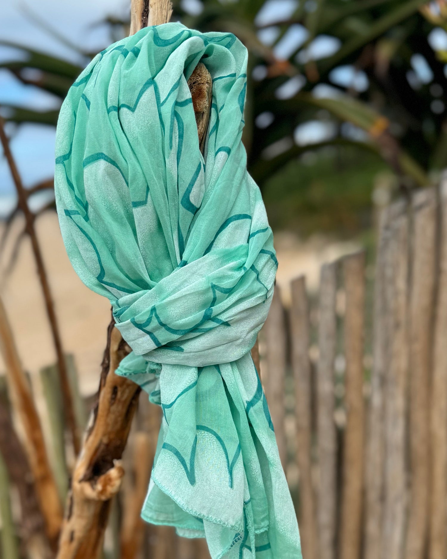 Infuse a burst of color and elegance into your wardrobe with our selection of summer scarves. Designed to brighten up any outfit, this scarf features a vibrant floral print that adds a fresh, lively touch to your look. Made from lightweight, breathable fabric, it drapes beautifully and provides just the right amount of warmth for those breezy summer days. Whether you’re dressing up a simple tee or adding flair to a sundress, this scarf is your go-to accessory for effortlessly elevating your style and embrac