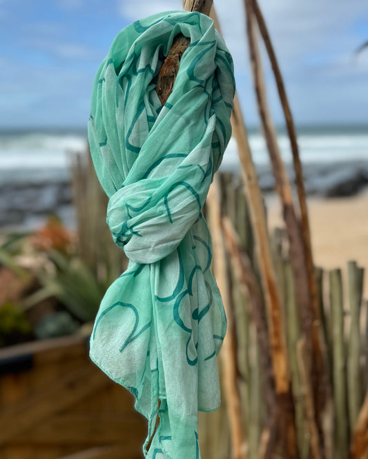 Infuse a burst of color and elegance into your wardrobe with our selection of summer scarves. Designed to brighten up any outfit, this scarf features a vibrant floral print that adds a fresh, lively touch to your look. Made from lightweight, breathable fabric, it drapes beautifully and provides just the right amount of warmth for those breezy summer days. Whether you’re dressing up a simple tee or adding flair to a sundress, this scarf is your go-to accessory for effortlessly elevating your style and embrac