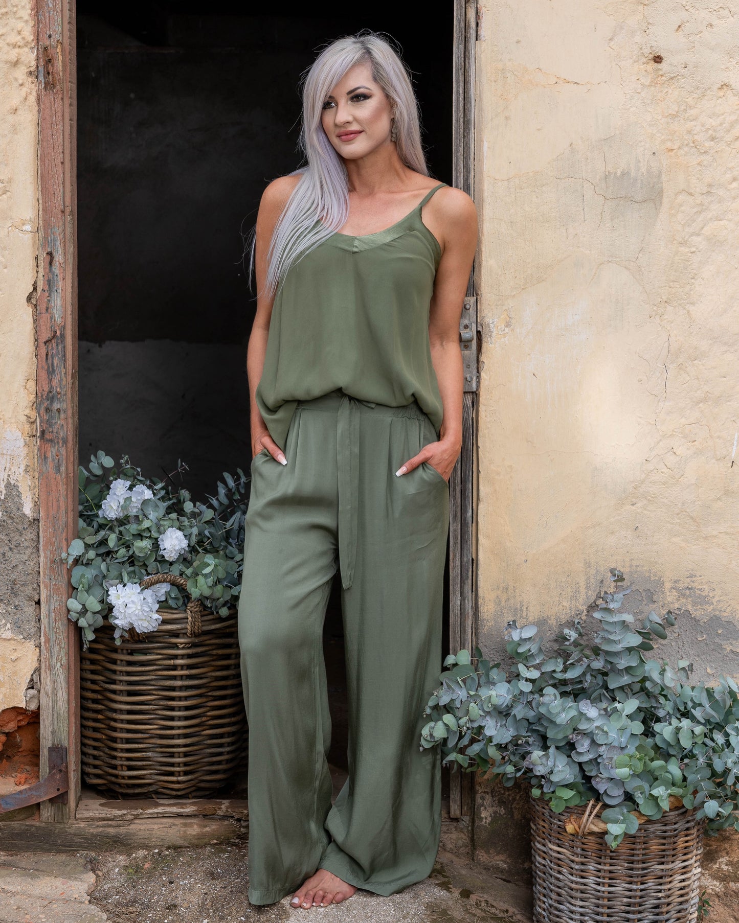These pants offer a super soft and cool feel against your skin, perfect for warm days or lounging in style. The wide-leg design ensures a flattering silhouette, while the elasticated waistband provides a comfortable fit that moves with you. A decorative drawstring bow adds a touch of charm and versatility, making these pants as stylish as they are practical. Whether you're dressing up for an evening out or keeping it casual, these pants are your go-to for easy elegance