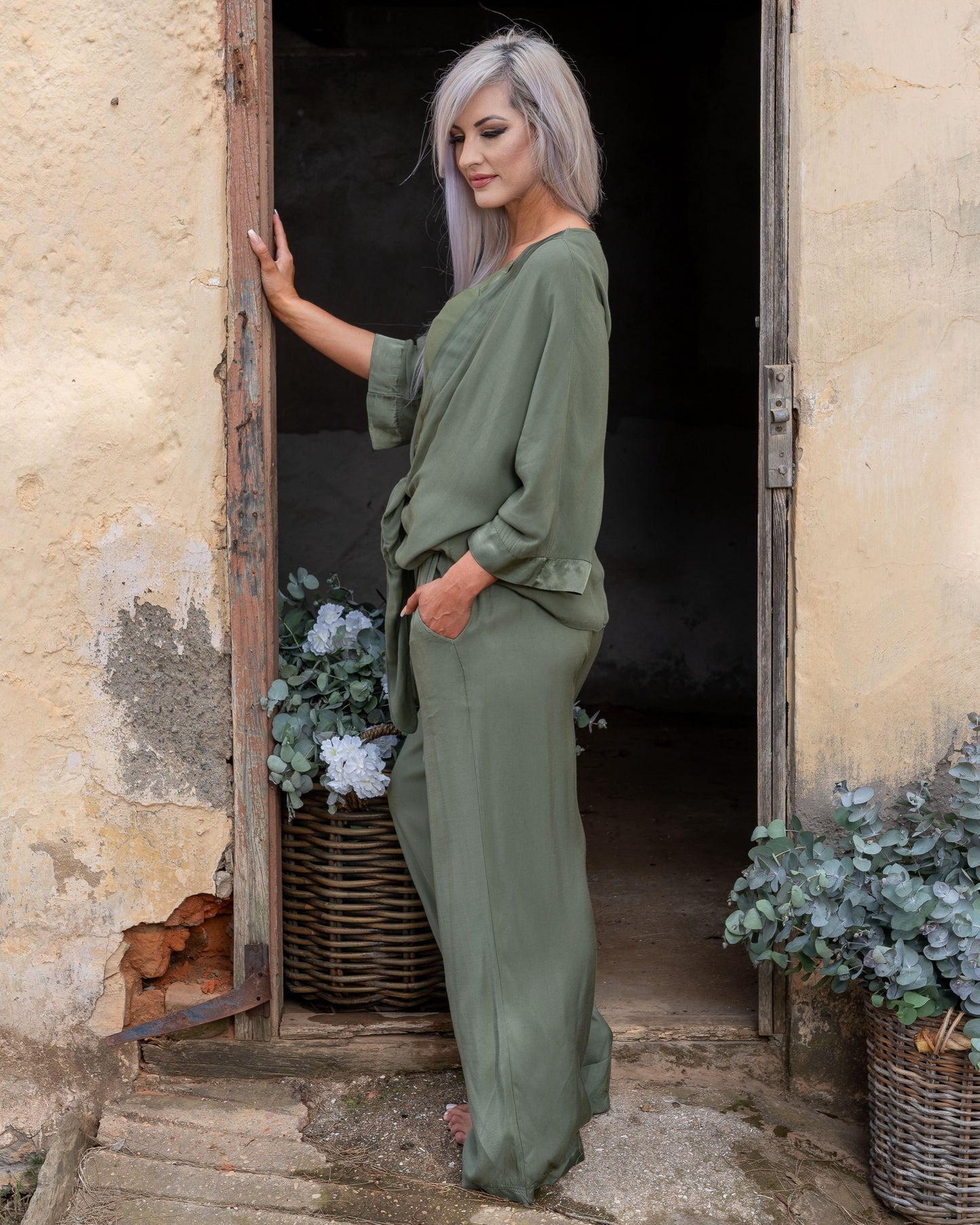 These pants offer a super soft and cool feel against your skin, perfect for warm days or lounging in style. The wide-leg design ensures a flattering silhouette, while the elasticated waistband provides a comfortable fit that moves with you. A decorative drawstring bow adds a touch of charm and versatility, making these pants as stylish as they are practical. Whether you're dressing up for an evening out or keeping it casual, these pants are your go-to for easy elegance