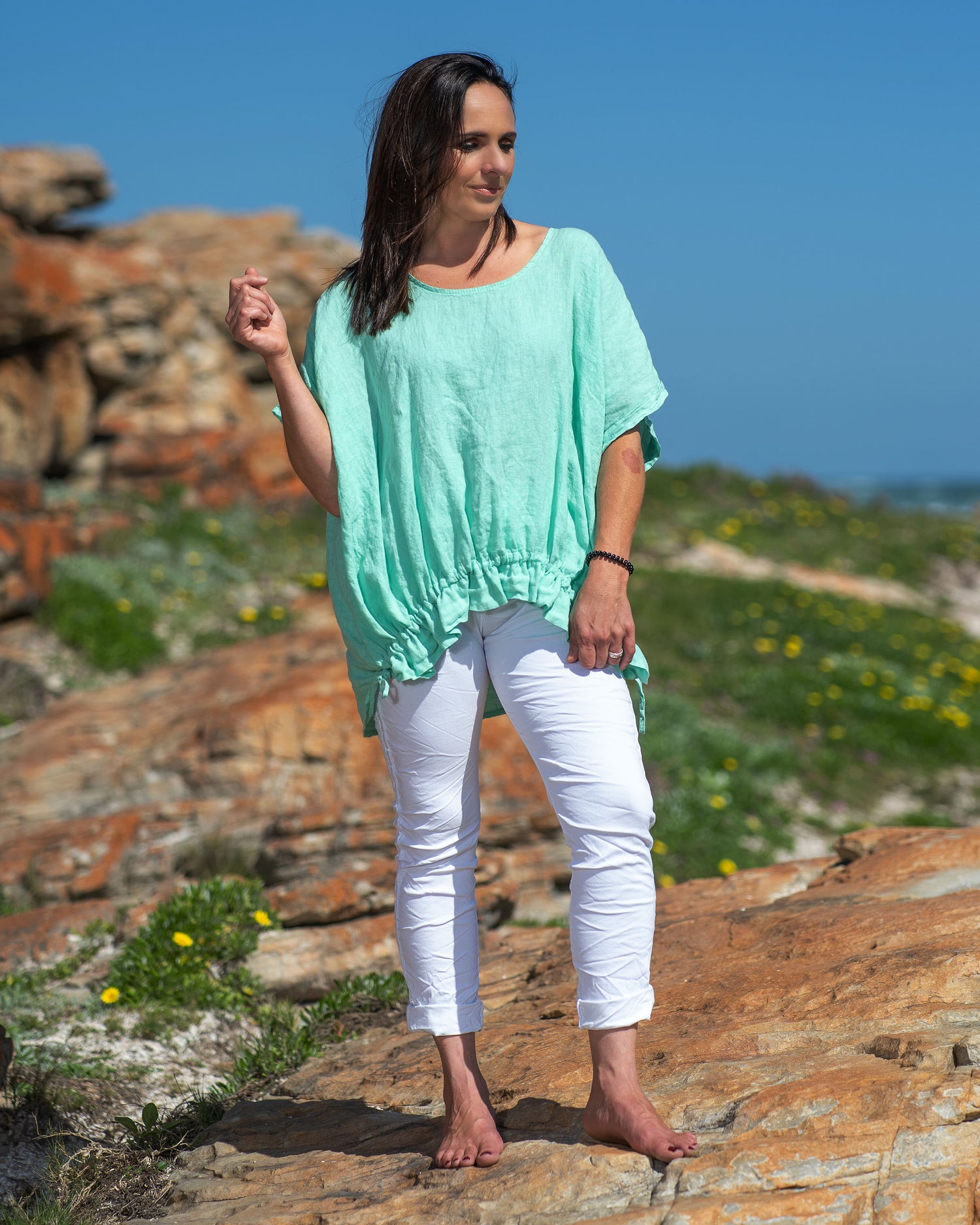 Step into the world of casual chic with this very comfortable, yet stylish linen top. What sets this top apart is its playful frill detailing, adding a touch of whimsy and femininity to your look. The natural, breathable linen fabric keeps you cool and fresh even on the warmest days, making it a must-have addition to your summer wardrobe