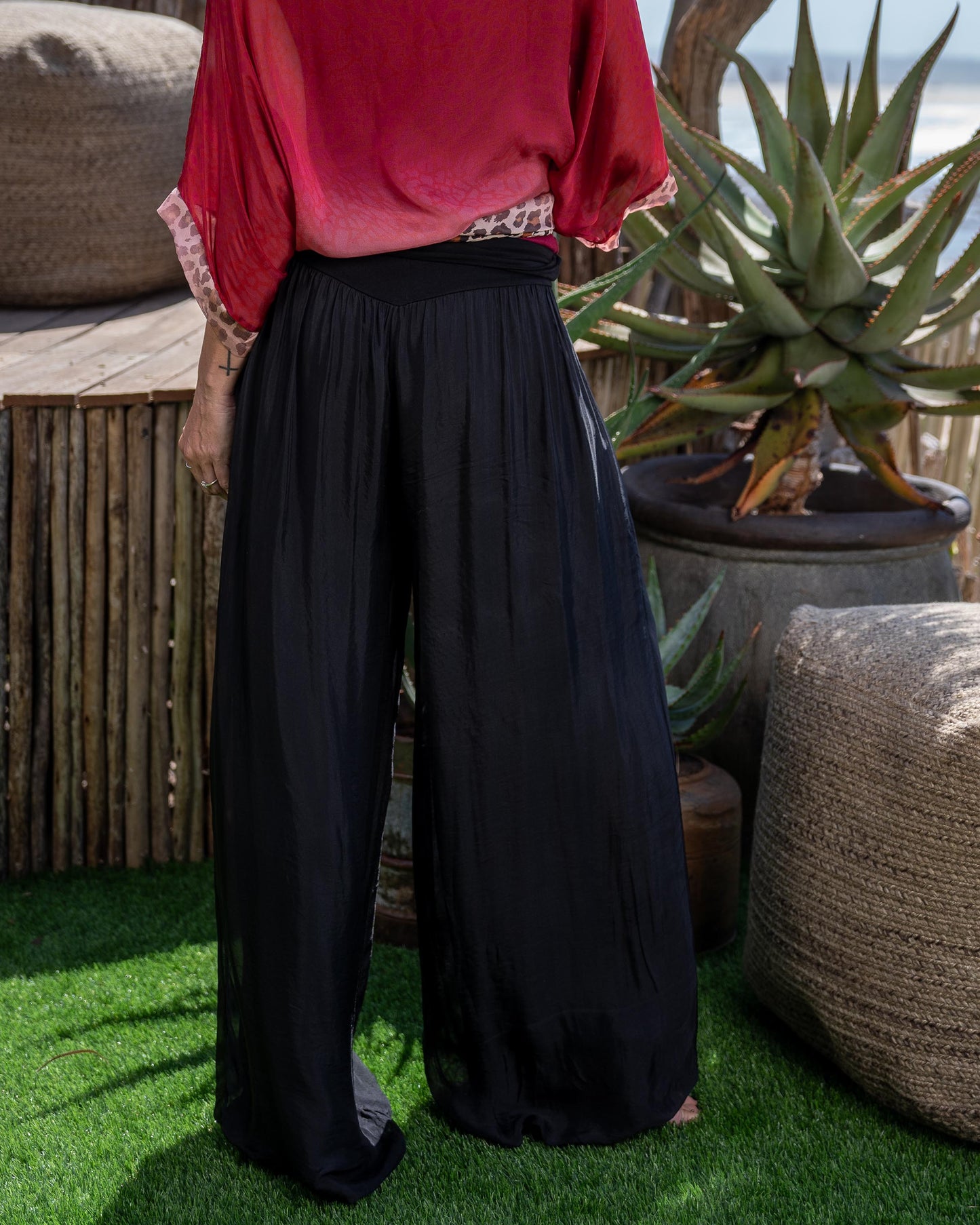 These pants move with you, ensuring all-day comfort without compromising on style.The outer lining crafted from luxurious silk blend adds a touch of sophistication and refinement to these bohemian-inspired pants. The silky smooth texture not only feels incredible against your skin but also elevates your look with a subtle sheen. Featuring a wide, stretchy waistband, these pants offer a secure and comfortable fit that flatters your figure and accentuates your waistline