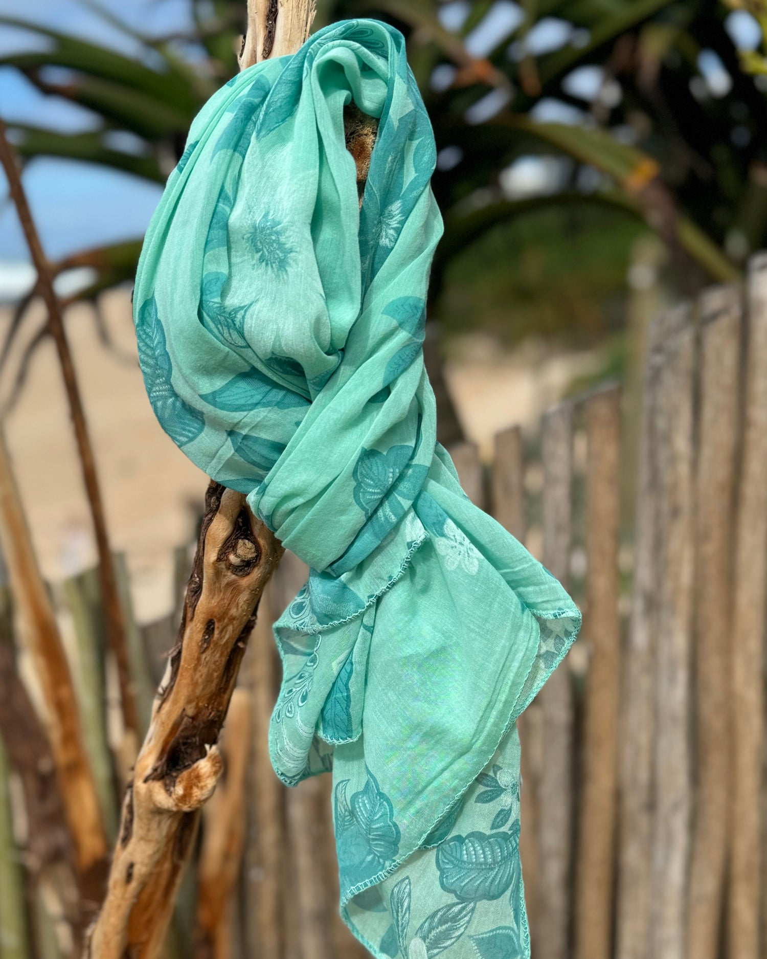 Infuse a burst of color and elegance into your wardrobe with our selection of summer scarves. Designed to brighten up any outfit, this scarf features a vibrant floral print that adds a fresh, lively touch to your look. Made from lightweight, breathable fabric, it drapes beautifully and provides just the right amount of warmth for those breezy summer days. Whether you’re dressing up a simple tee or adding flair to a sundress, this scarf is your go-to accessory for effortlessly elevating your style and embrac