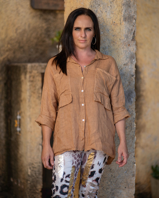 A versatile and effortlessly stylish addition to your wardrobe. Crafted from lightweight linen fabric, this shirt offers unbeatable comfort and breathability, making it perfect for those warm days. What sets this shirt apart is its attention to detail, particularly the stylish double pockets adorning the chest area. These pockets not only add a touch of flair but also provide functional storage for your essentials