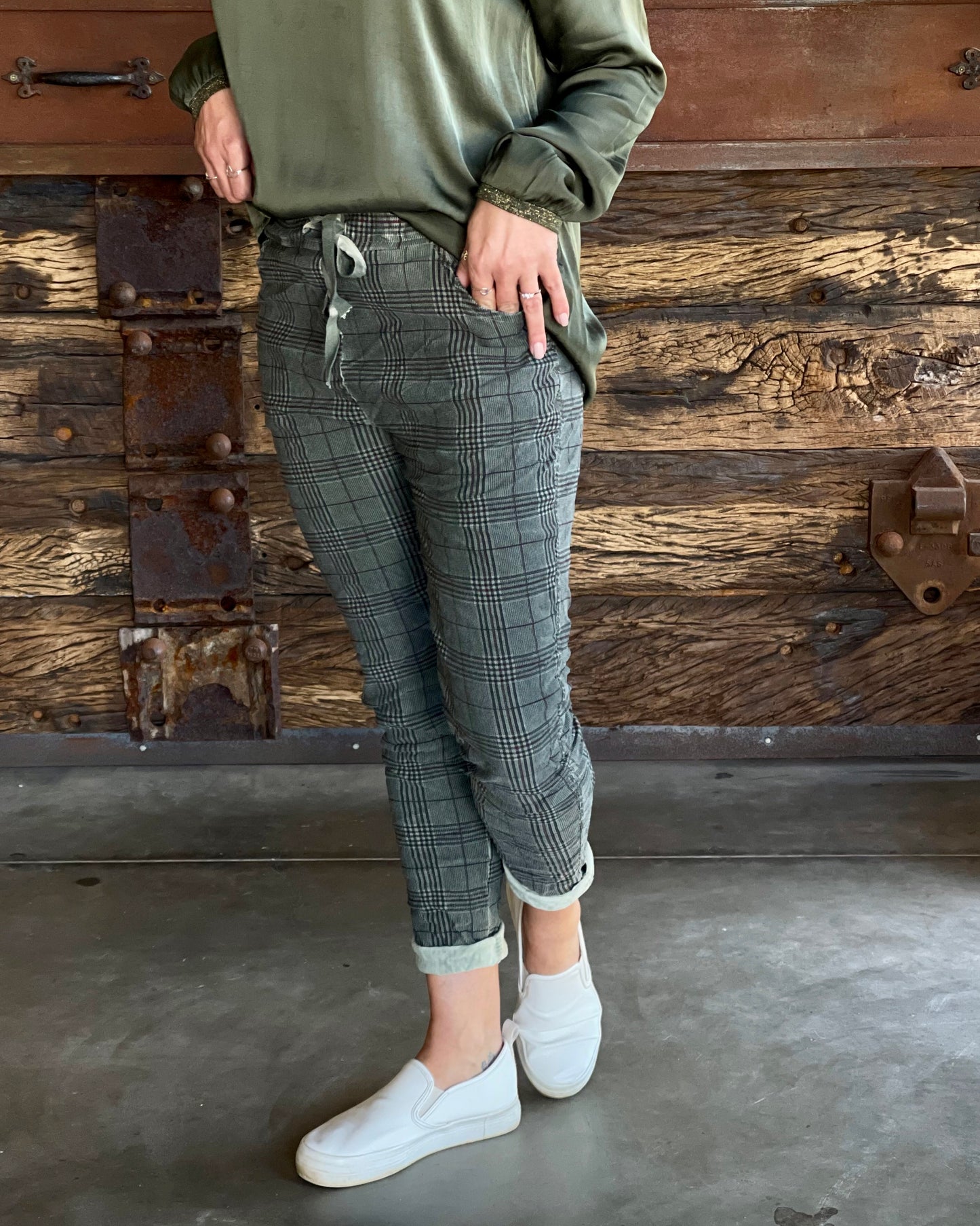 Back by popular demand! These warmer drawstrings pants are perfect for the coming winter. Suede like feel with a tartan print offer a unique combination of texture and pattern. The    print adds an additional layer of visual interest, with its pattern of intersecting lines