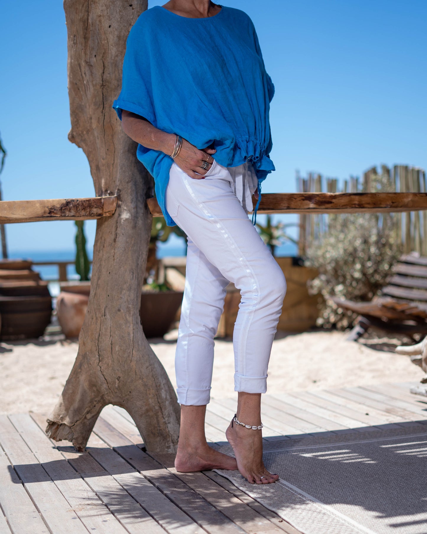 Back by POPULAR demand! This is our all time favourite that we cannot live without. The comfort these pants offer is spectacular. It features a satin strip down the leg for a little touch of glam. Don't miss out on these basic neutral staples