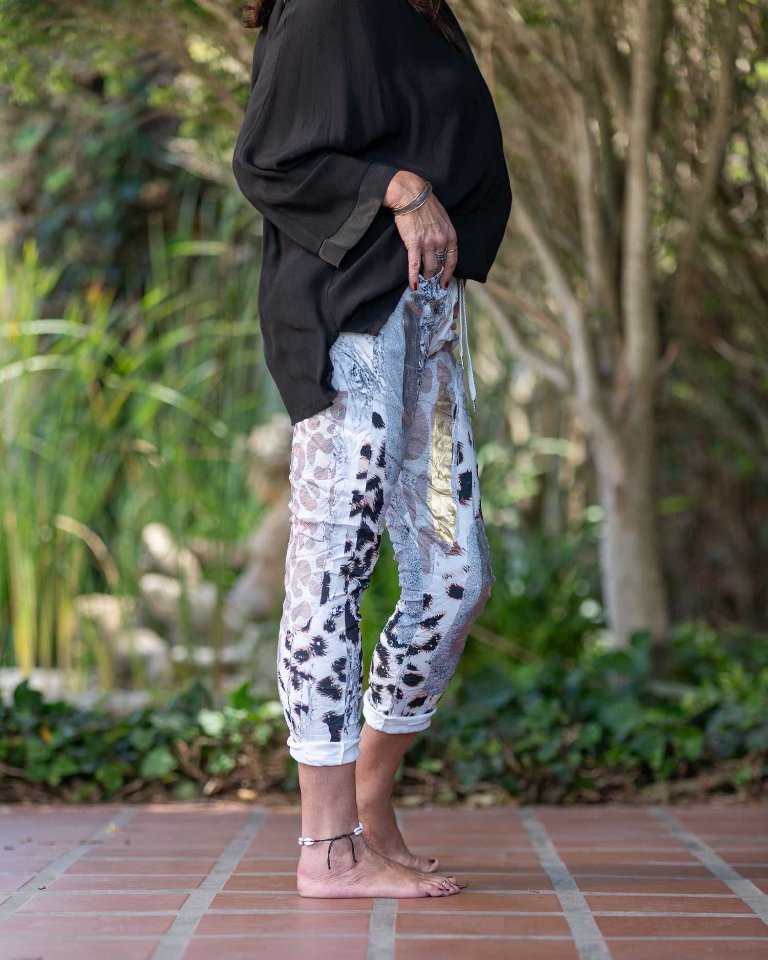 Our italian drawstring pants are known and loved by everyone. This pair offers exceptional comfort with a soft feel against your skin. Beautiful silver foil print with a eye catching animal print adds a touch of playfulness to design. The pairing options are endless for this pair