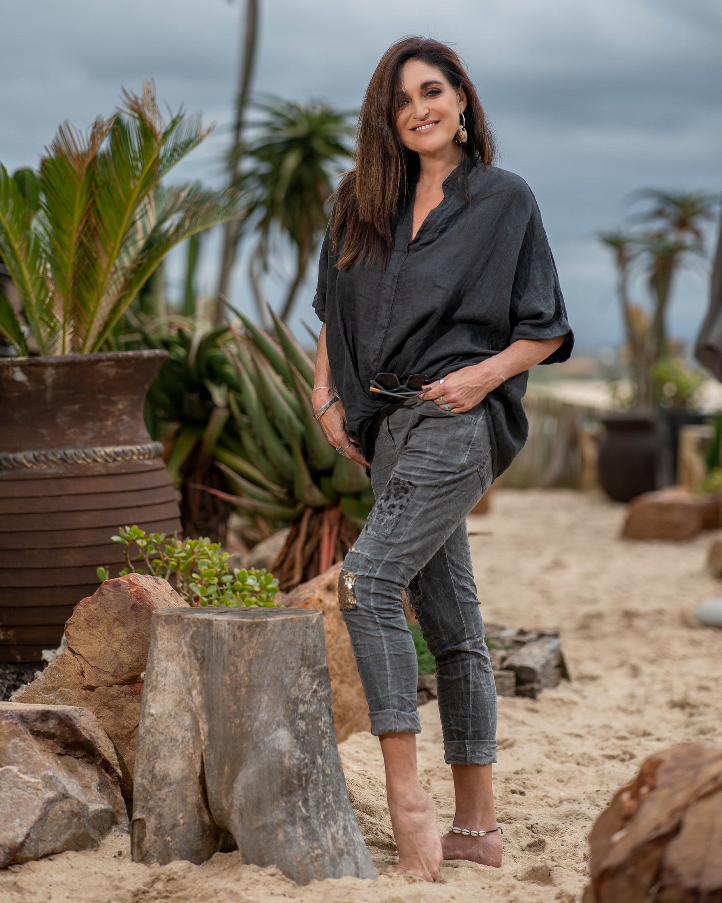 The subtle twist detail not only enhances the visual appeal but also provides a flattering fit, accentuating your waistline and creating a feminine, flowing effect. The batwing sleeves drape gracefully, creating a sense of airiness and movement. Whether you're heading to brunch, a beachside gathering, or a casual day out, this top effortlessly elevates your style