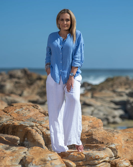 This beautiful linen top makes us all excited for summer, just around the corner! A celebration of delicate charm and timeless elegance. This top is designed to envelop you in the soft hues of summer and enhance your natural grace with its thoughtfully crafted design