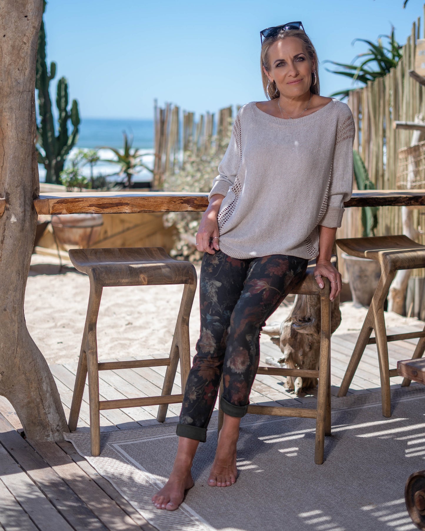 This knit features a playful infusion of glitter threads throughout, creating a shimmering effect. Batwing cut ensure ultimate comfort with a flattering overall fit. Ribbed side panels that not only enhance the overall fit but also provide a subtle texture contrast