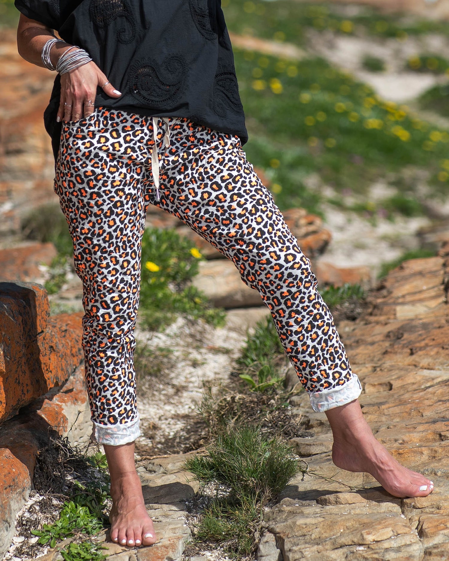 Available in a range of vibrant luminescence colors, these pants offer a fresh and modern twist on the classic leopard print pattern. The fusion of wild and vivid tones adds an electrifying touch, ensuring you stand out wherever you go