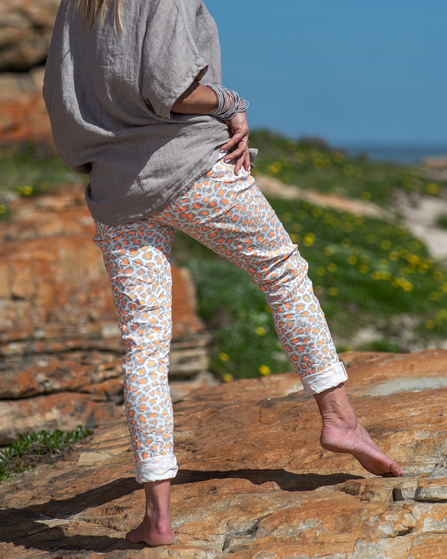 Available in a range of vibrant luminescence colors, these pants offer a fresh and modern twist on the classic leopard print pattern. The fusion of wild and vivid tones adds an electrifying touch, ensuring you stand out wherever you go
