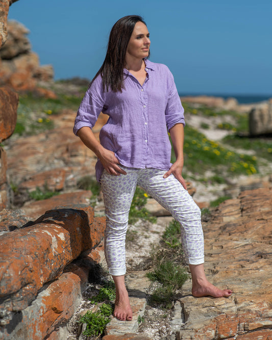 In a dreamy shade of Lavish Lavender, this top adds a touch of grace to any ensemble. The button-down design allows for versatile styling, whether you prefer a relaxed, open look or a neatly buttoned-up silhouette. It has a comfortable fit with a slight A-frame cut