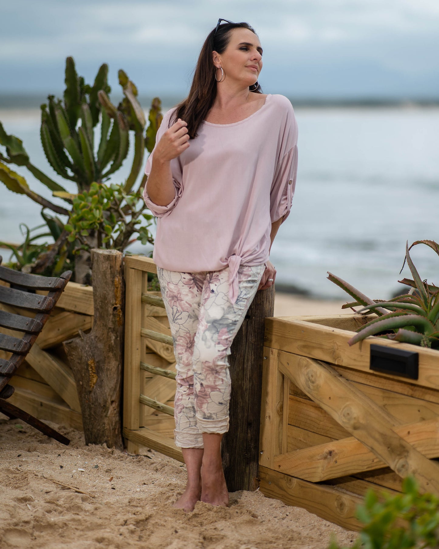 The batwing cut offers a relaxed and airy silhouette, ensuring a comfortable fit while adding a touch of contemporary flair. The round neck enhances the casual charm of the top. The unique front twist not only introduces a touch of creativity but also creates a flattering drape, enhancing the overall visual appeal