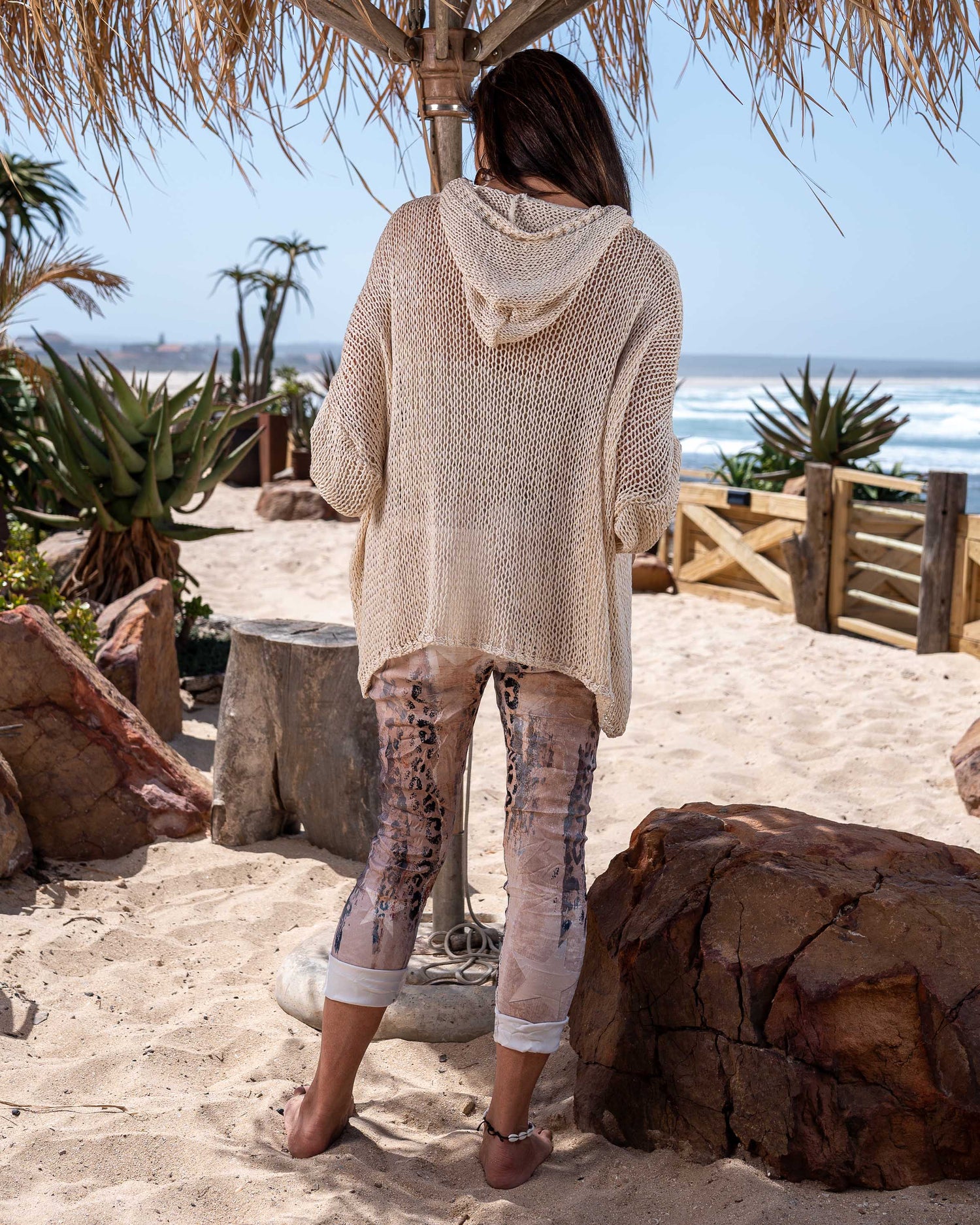 Designed for those who crave comfort without compromising style, this poncho is the ultimate statement piece for your wardrobe. Crafted from premium quality knit fabric, this poncho boasts a luxurious oversized silhouette that effortlessly drapes over your body, offering both warmth and elegance