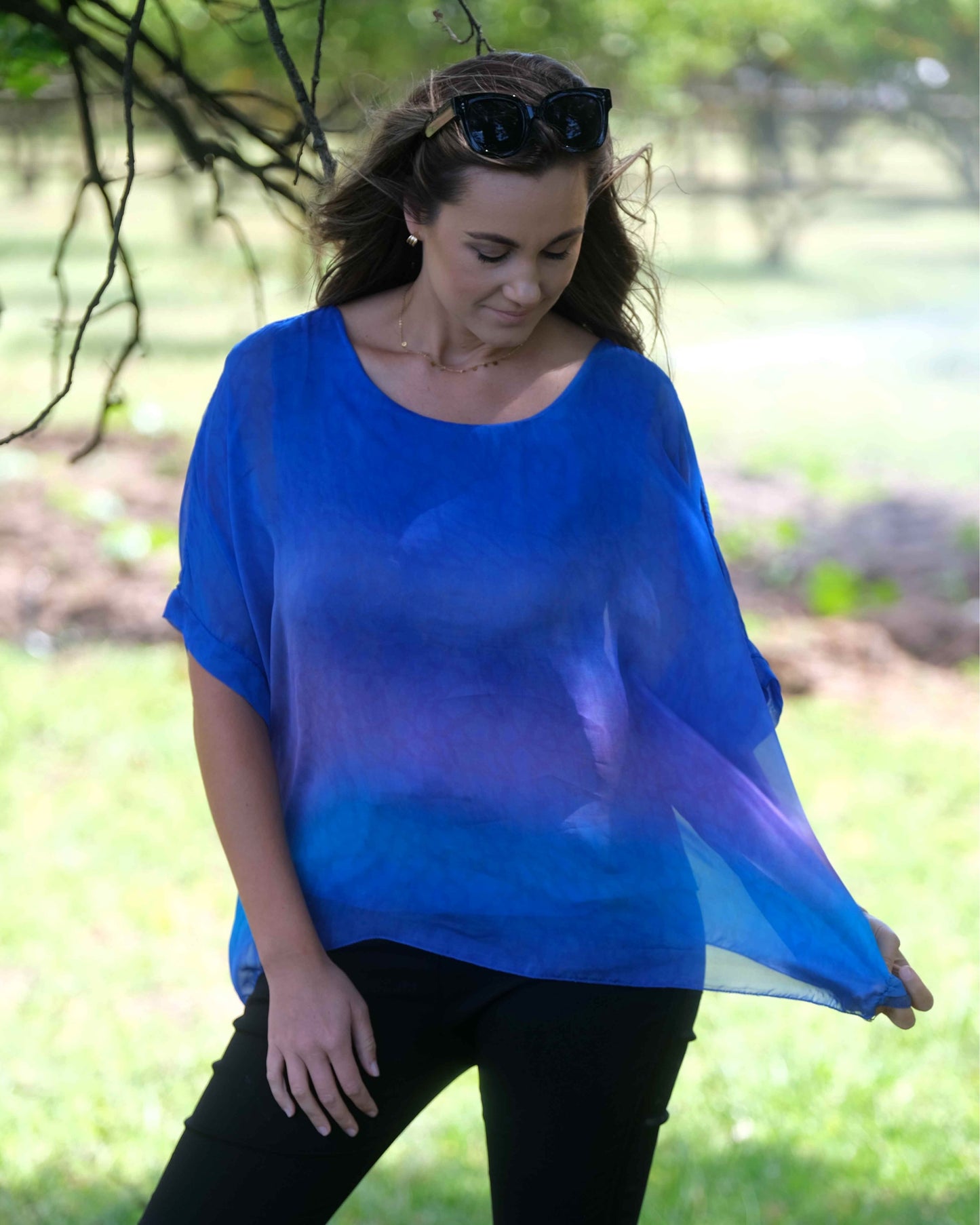 We know our clients adore these type of styles. Stunning ombré colors with a cami insert – a masterpiece of design that seamlessly combines the timeless allure of silk blend with a modern twist. This top is your gateway to effortless elegance, comfort, and a touch of vibrant ombré magic