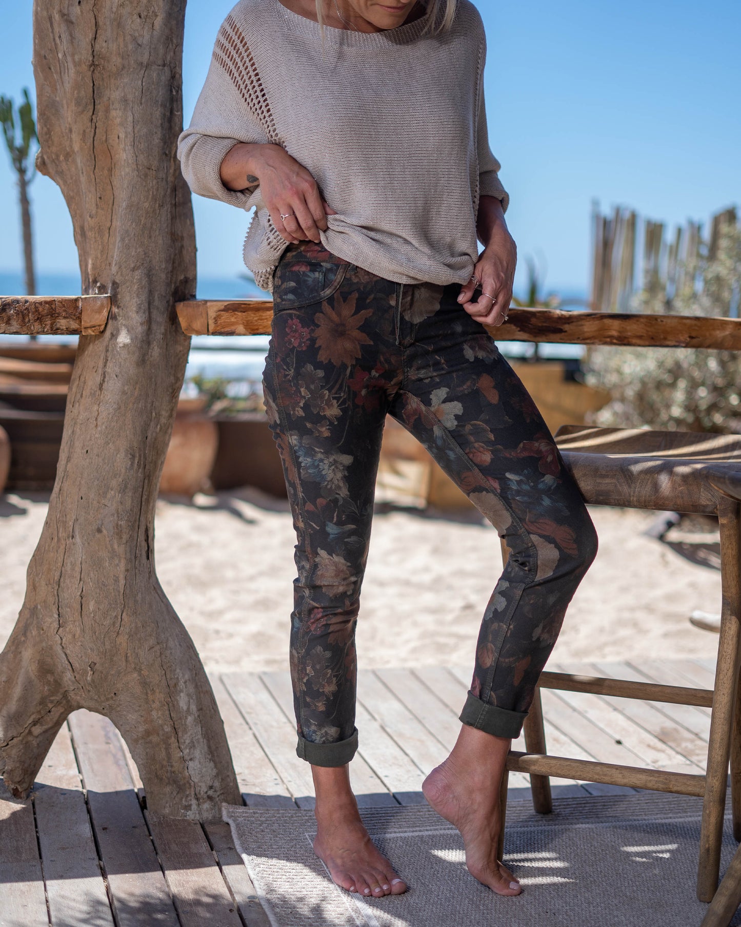 A single pair of jeans that effortlessly transitions from bold floral elegance to sleek block color, ensuring you're always ready for any fashion mood. On one side, embrace the vibrant beauty of nature with our eye-catching floral print. On the flip side, revel in the simplicity and sophistication of the block color design. This jean is a straight cut with a medium cut waistband