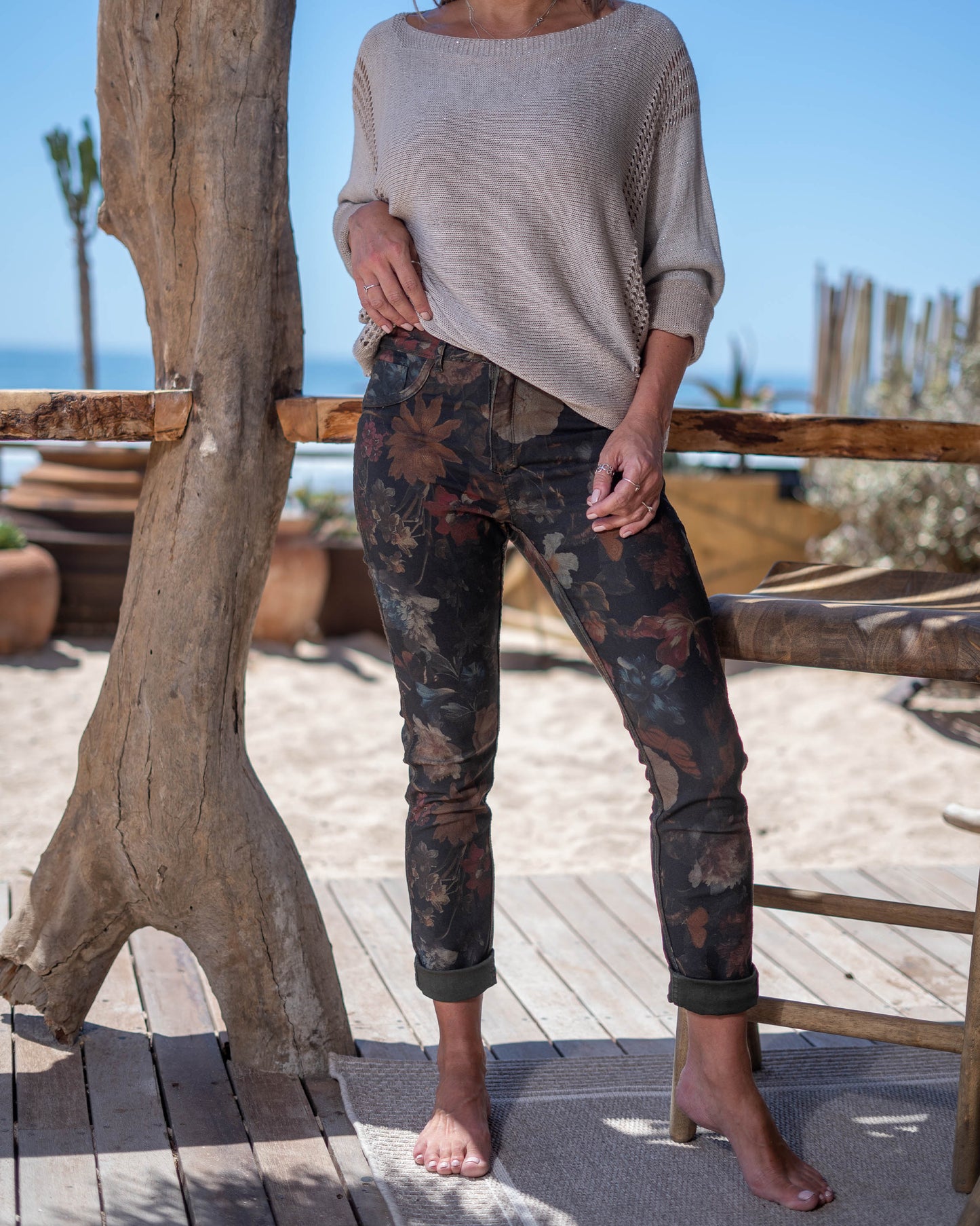 A single pair of jeans that effortlessly transitions from bold floral elegance to sleek block color, ensuring you're always ready for any fashion mood. On one side, embrace the vibrant beauty of nature with our eye-catching floral print. On the flip side, revel in the simplicity and sophistication of the block color design. This jean is a straight cut with a medium cut waistband