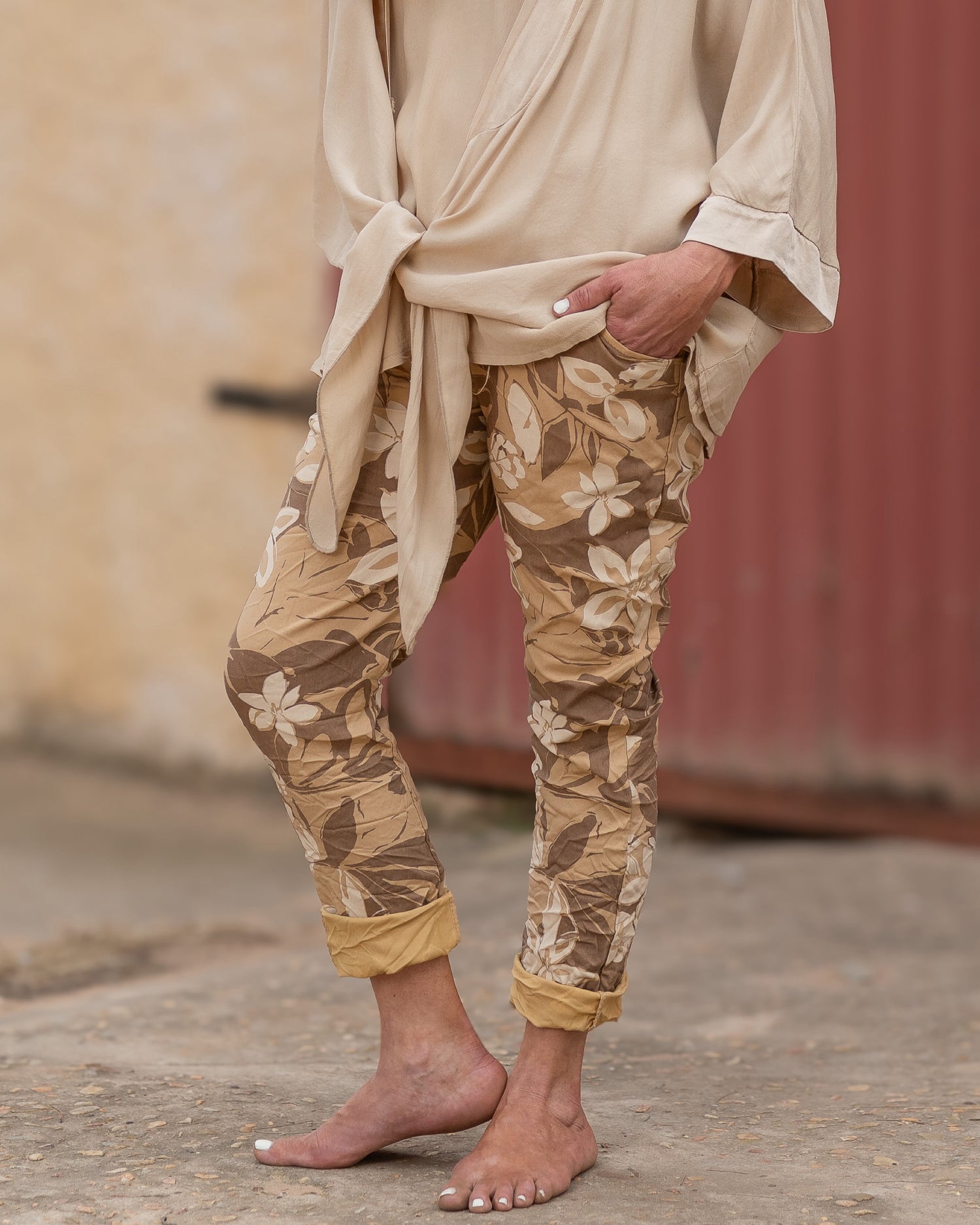 A bold flower print that brings a splash of color to any outfit. These pants are designed for those who love to express their personality through their wardrobe. The eye-catching floral pattern is enhanced by a blend of color hues, creating a lively look that’s perfect for any season.&nbsp;The elasticated waistband with a functional drawstring ensures a comfortable and adjustable fit, while the relaxed silhouette provides freedom of movement. These pants are not just about style; they’re also about ease, ma