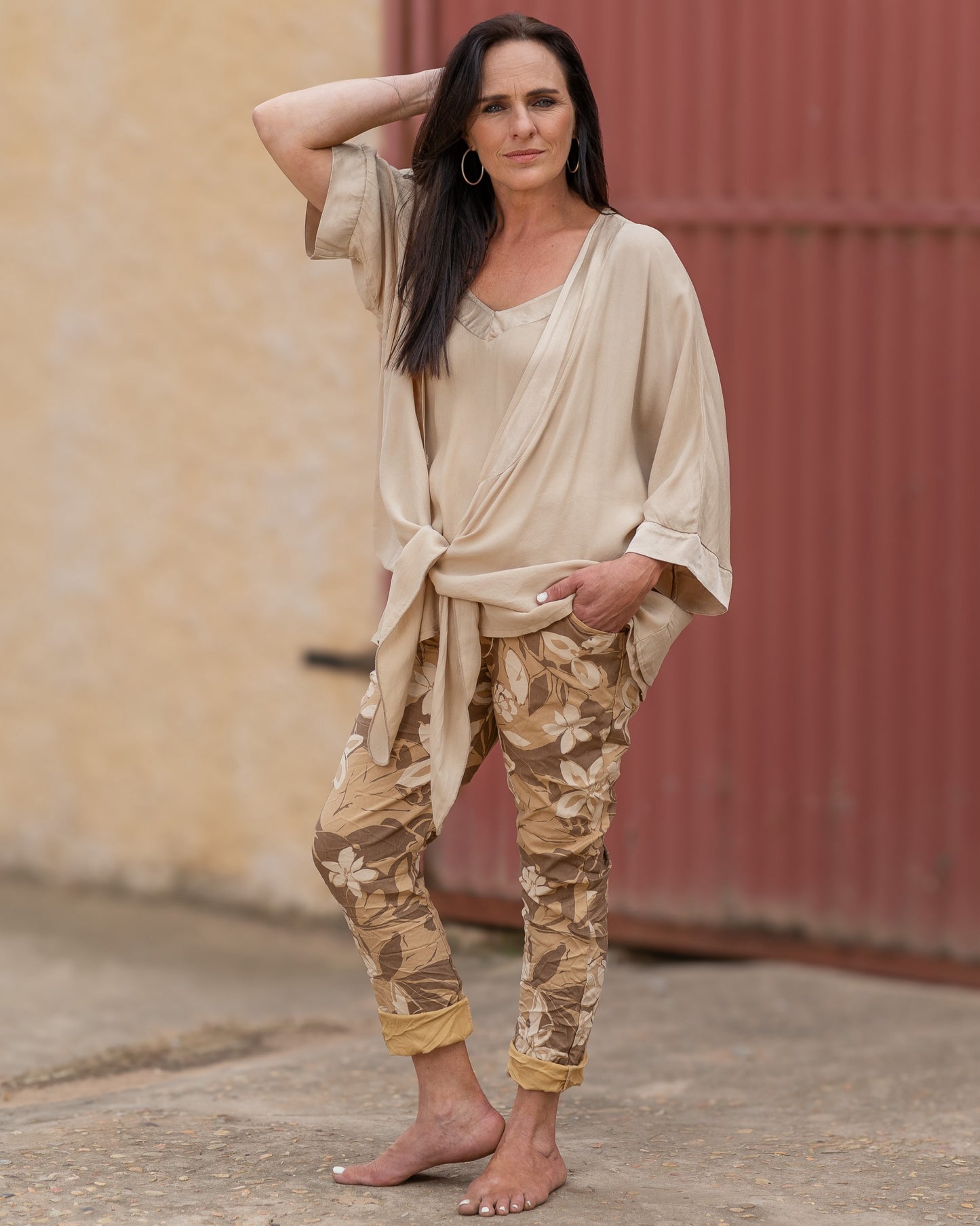 A bold flower print that brings a splash of color to any outfit. These pants are designed for those who love to express their personality through their wardrobe. The eye-catching floral pattern is enhanced by a blend of color hues, creating a lively look that’s perfect for any season.&nbsp;The elasticated waistband with a functional drawstring ensures a comfortable and adjustable fit, while the relaxed silhouette provides freedom of movement. These pants are not just about style; they’re also about ease, ma