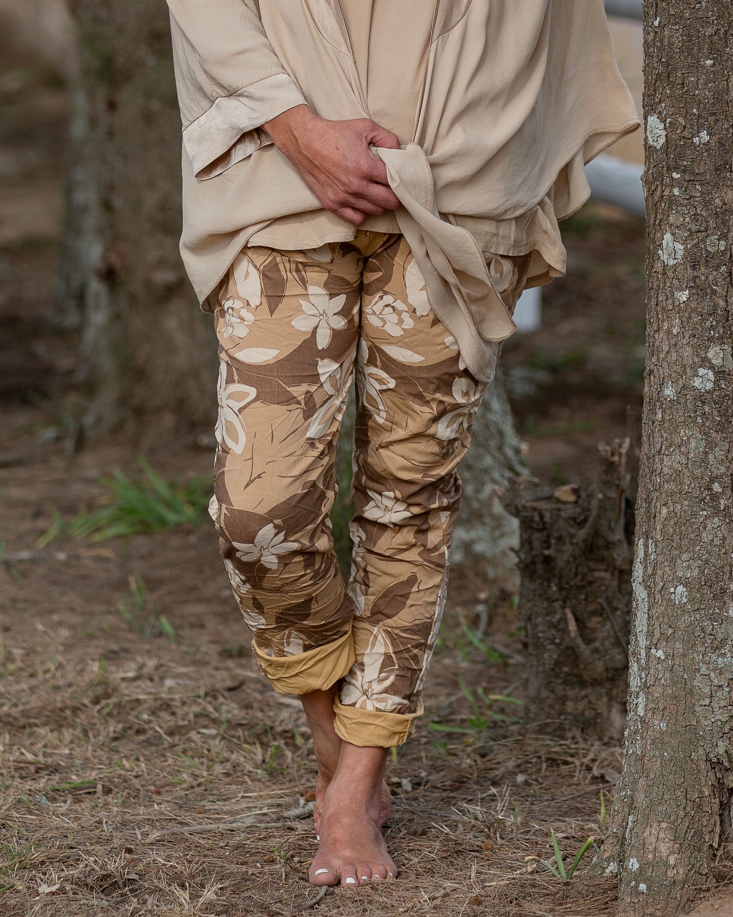 A bold flower print that brings a splash of color to any outfit. These pants are designed for those who love to express their personality through their wardrobe. The eye-catching floral pattern is enhanced by a blend of color hues, creating a lively look that’s perfect for any season.&nbsp;The elasticated waistband with a functional drawstring ensures a comfortable and adjustable fit, while the relaxed silhouette provides freedom of movement. These pants are not just about style; they’re also about ease, ma