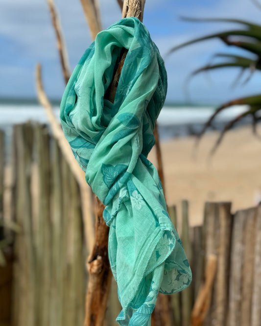 Infuse a burst of color and elegance into your wardrobe with our selection of summer scarves. Designed to brighten up any outfit, this scarf features a vibrant floral print that adds a fresh, lively touch to your look. Made from lightweight, breathable fabric, it drapes beautifully and provides just the right amount of warmth for those breezy summer days. Whether you’re dressing up a simple tee or adding flair to a sundress, this scarf is your go-to accessory for effortlessly elevating your style and embrac