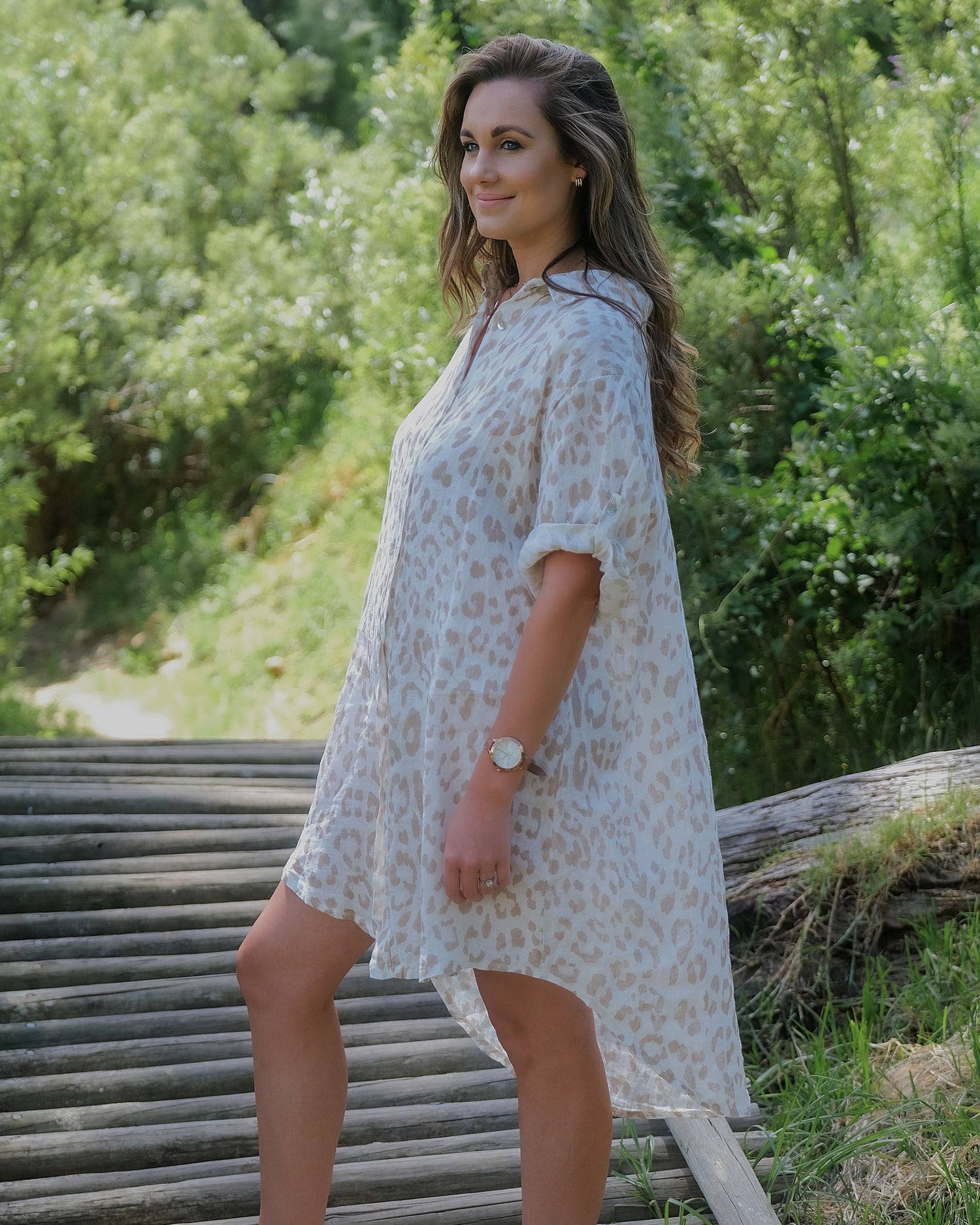 Embrace effortless elegance of this lovely linen dress. The subtle animal print, tastefully incorporated into the fabric, adds a hint of wild sophistication. Pair it with sandals and a sun hat for a relaxed daytime look or elevate it with heels and statement jewelry for a more formal affair